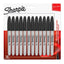 Twelve Sharpie fine tip black ink permanent markers arranged in a row on a white background.