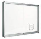 Bi-Office double door white display notice board with glass windows, enclosed design, measuring 1146x967mm.